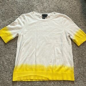 White and yellow short sleeve top.